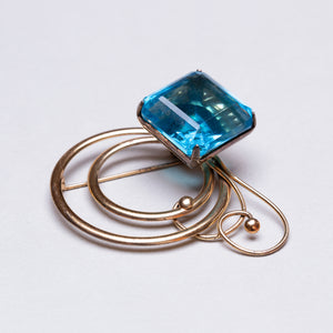 Vintage Gold Swirl Brooch with Blue Stone