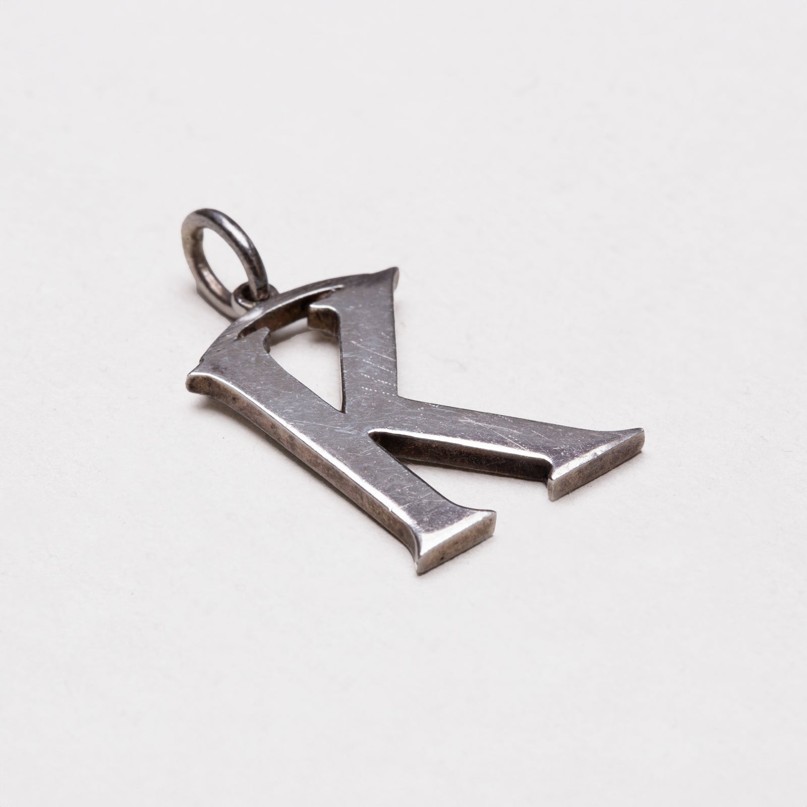 Vintage Cassandra Goad "K" Charm Pendant in Sterling Silver
