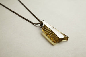 astonishingly original Art Deco necklace made with carved apple juice bakelite and chrome plated metal