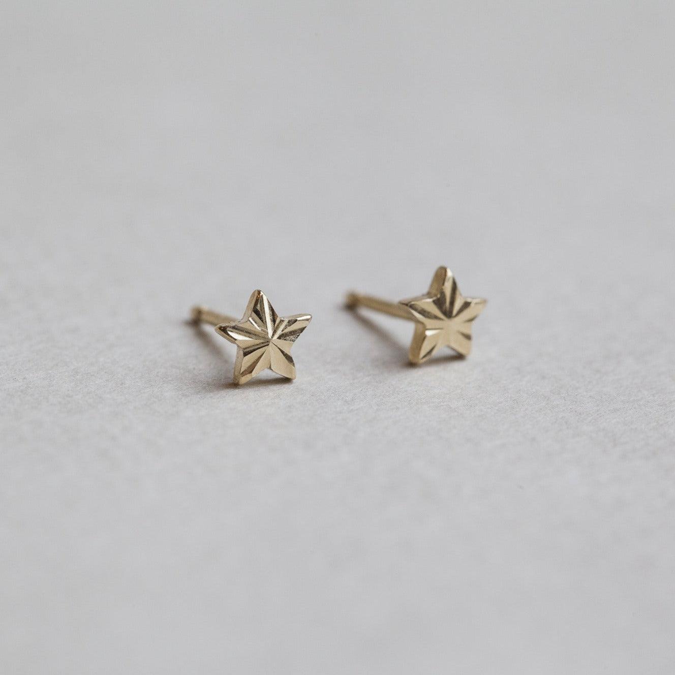 felt 9 carat gold micro star stud earrings