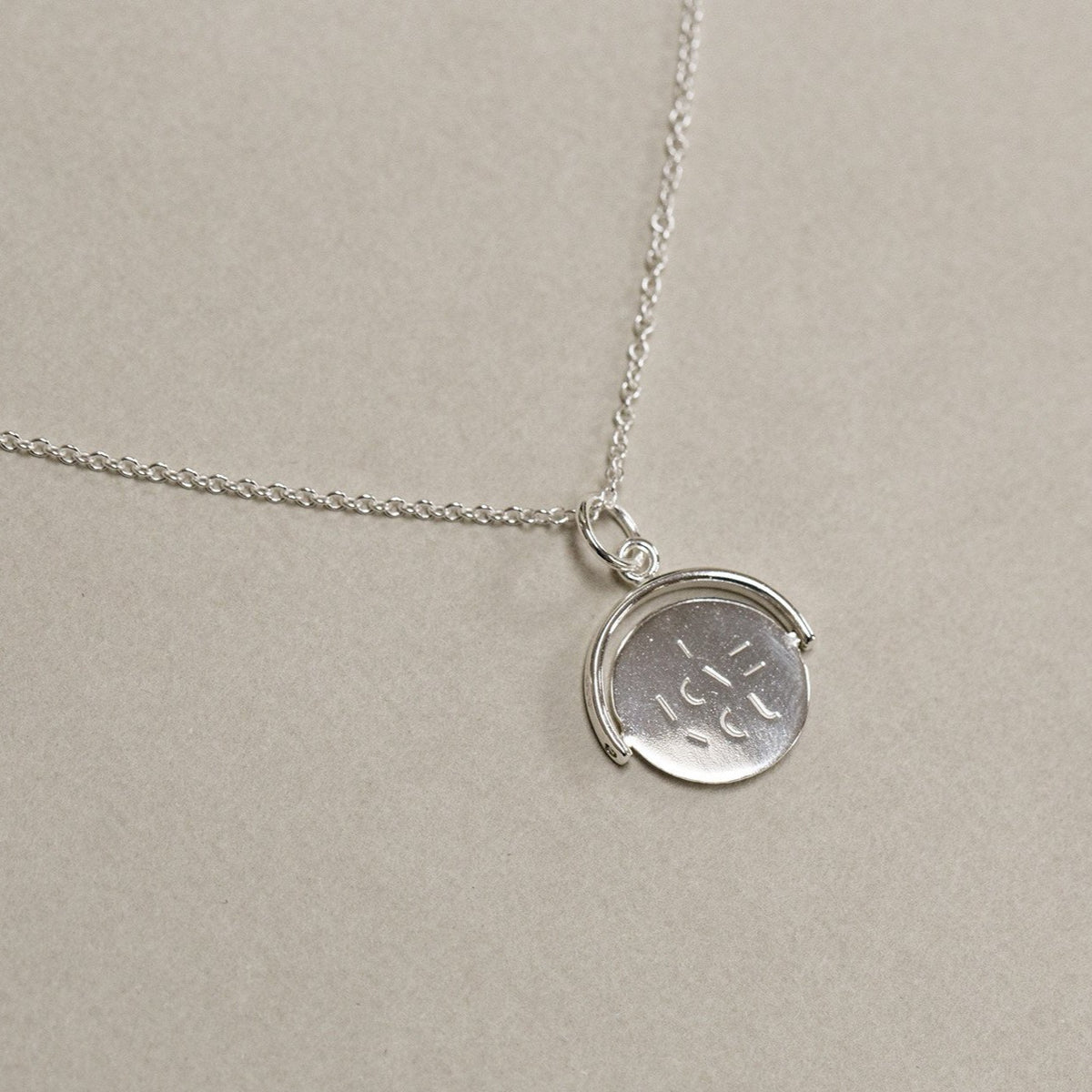 contemporary sterling silver spinning I love you necklace