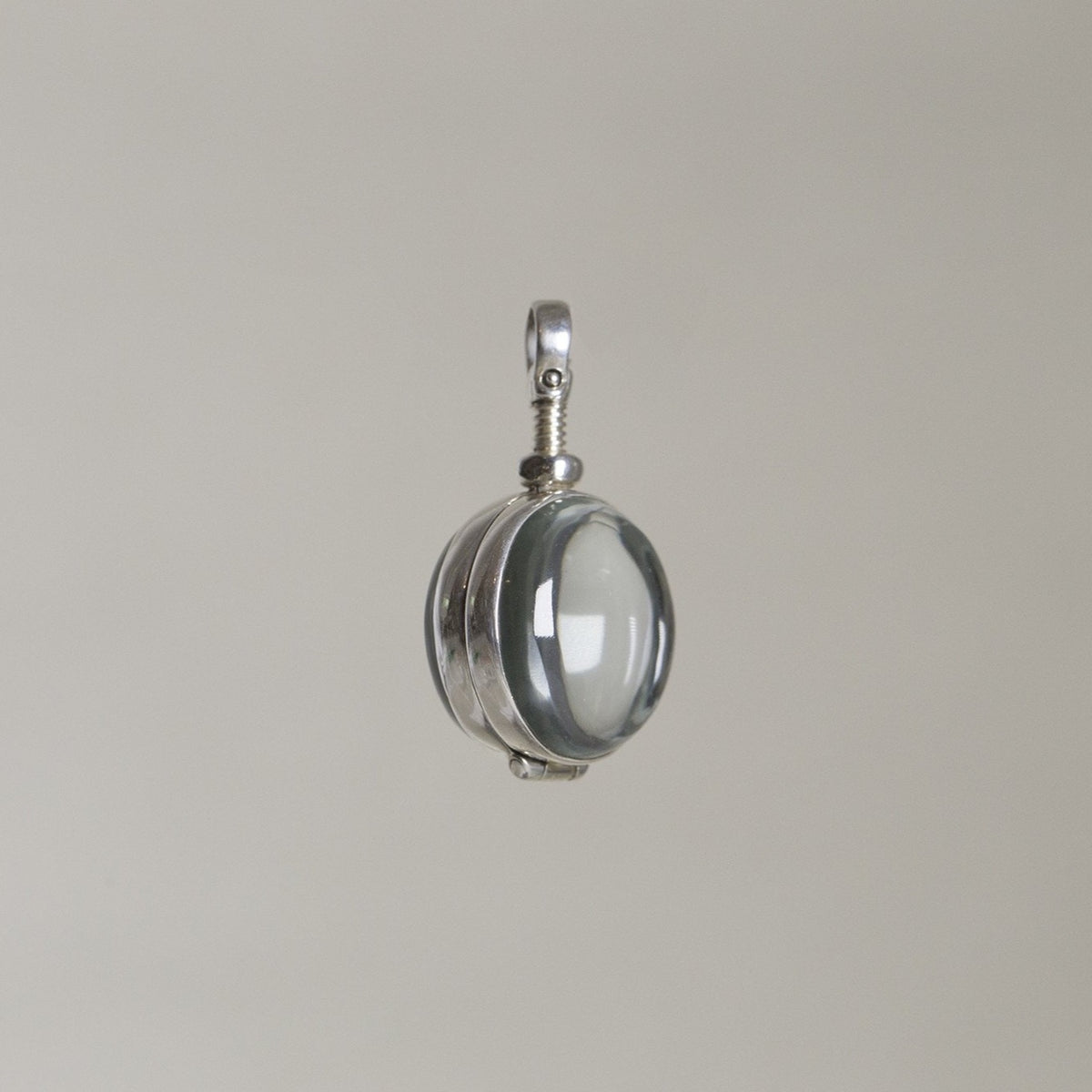 the intriguing mechanism of the glass cabochon locket from up close