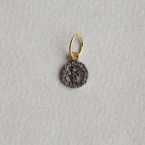 a tiny peace sign from the same collection also available at feltlondon.com