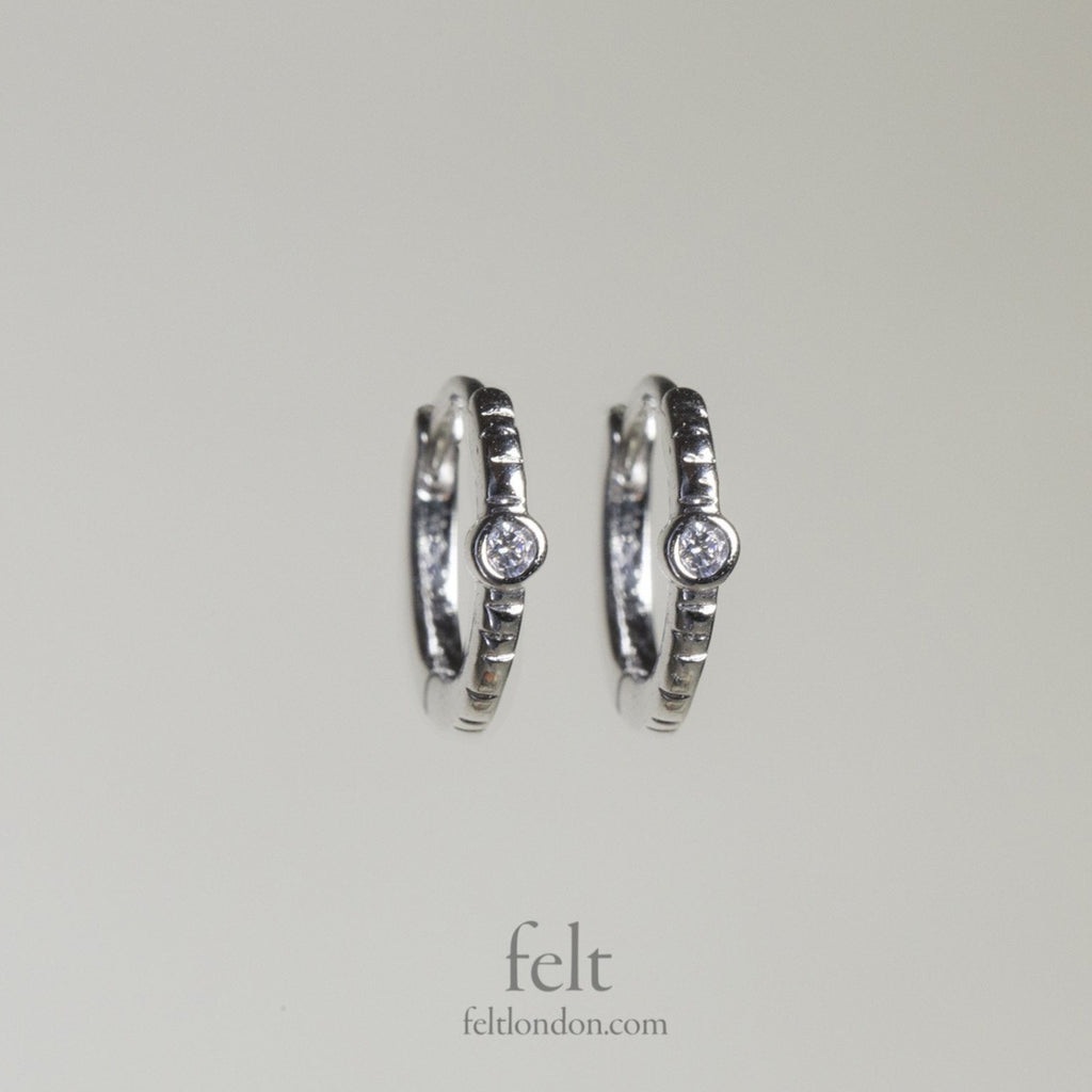 Single stone sleepers in sterling silver with a single cubic zirconia 