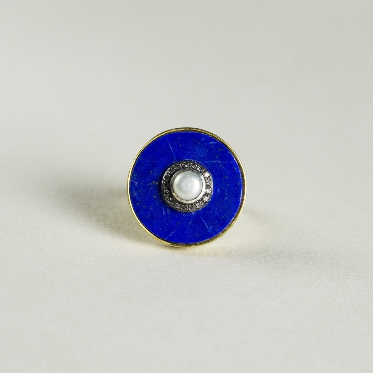 the large lapis disc with a pearl and diamond island
