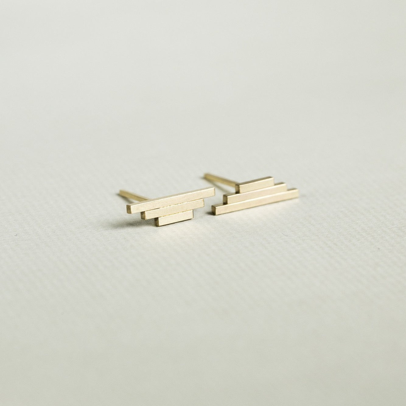 modern earrings of triple bars 