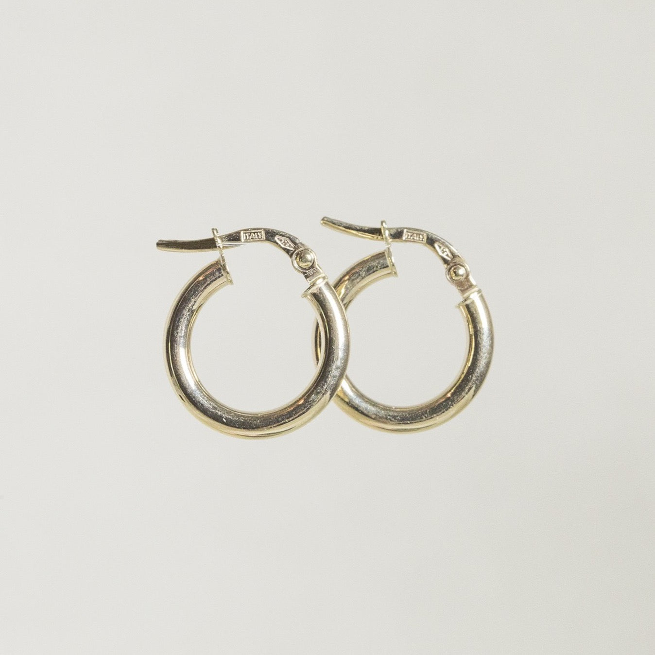 fantastically modern and light gold hoops