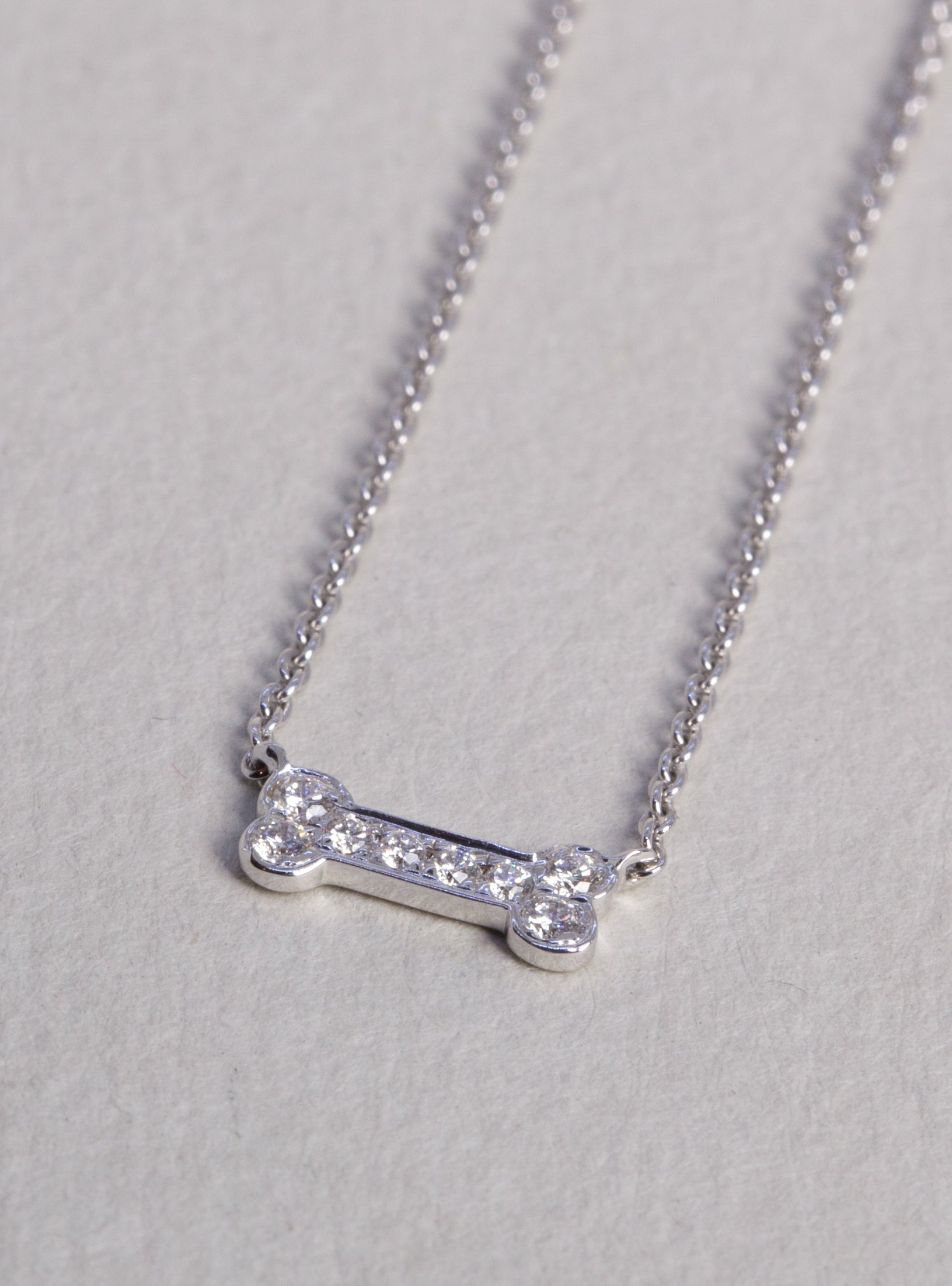 Dog bone white gold diamond necklace