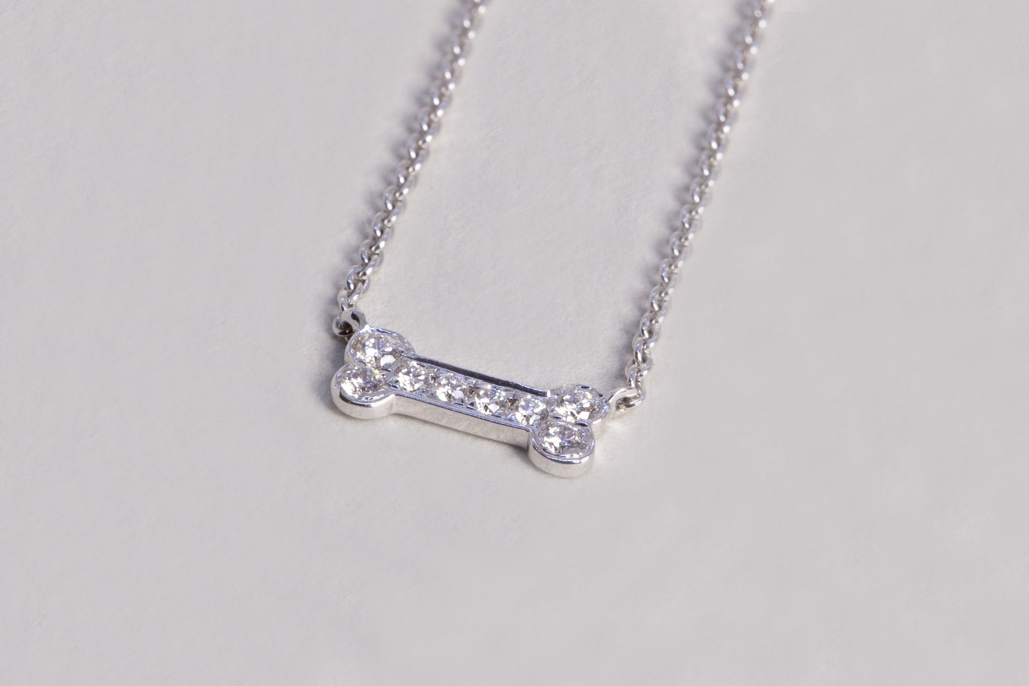 Dog bone white gold diamond necklace