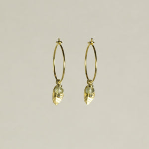 adorable leaf charm hoops with delicately iridescent aquamarine beads, also available at feltlondon.com