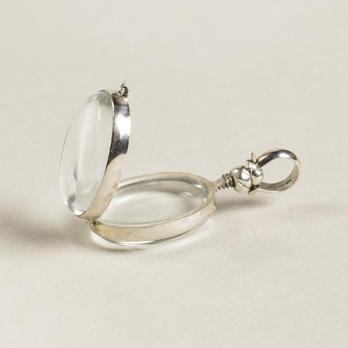opened oval locket seen from the side - same screw design is used in the round lockets